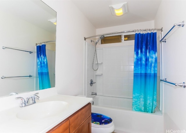 full bathroom with vanity, shower / bath combo with shower curtain, and toilet