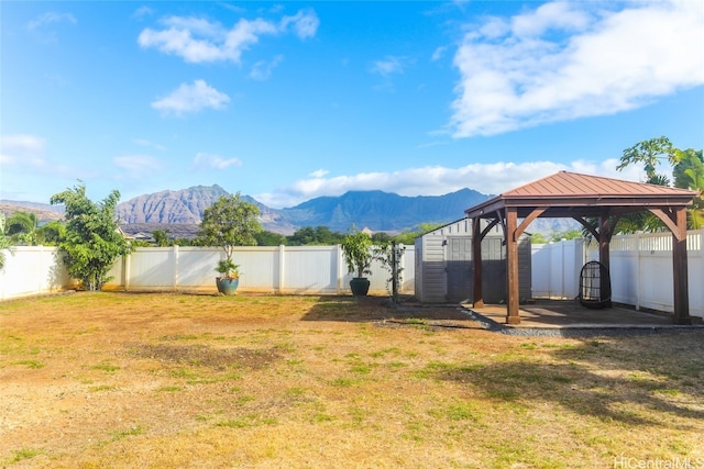 view of yard with a gazebo and a mountain view