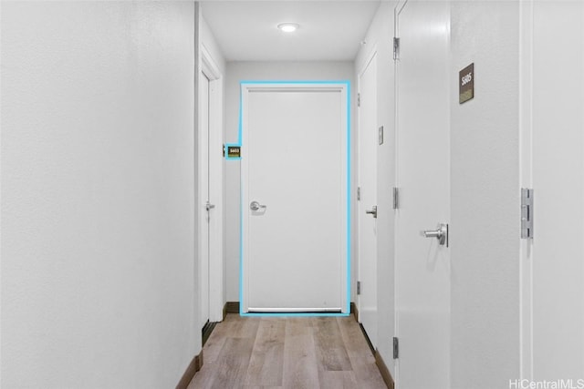 hallway featuring light hardwood / wood-style flooring