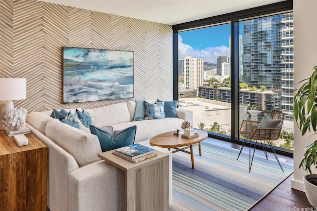 1100 Ala Moana Blvd Unit 1400/1402, Honolulu, HI 96814 - living room featuring wallpapered walls, wood finished floors, floor to ceiling windows, and a city view