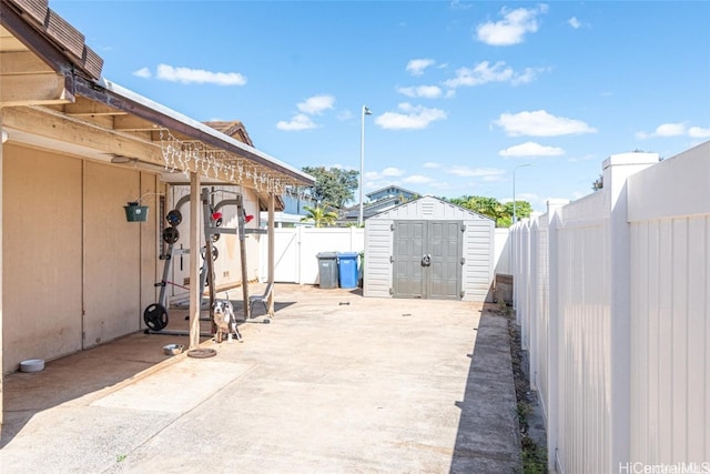 view of patio with a storage shed