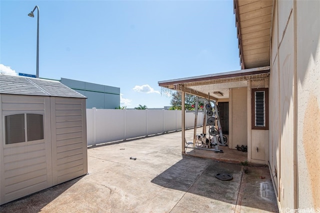 view of patio / terrace with a shed