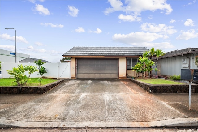 view of front of property with a garage