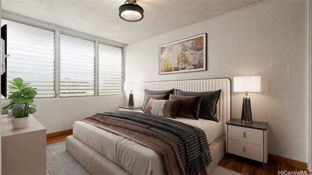 bedroom with dark wood-type flooring and a textured ceiling