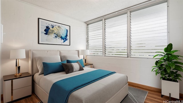 bedroom featuring a textured ceiling and dark wood-type flooring