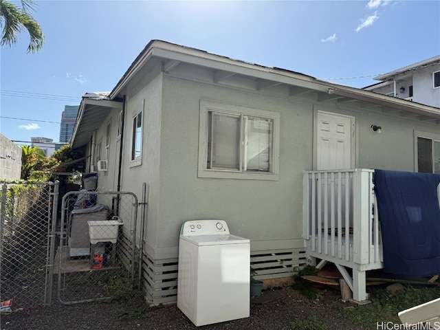 rear view of house featuring washer / clothes dryer