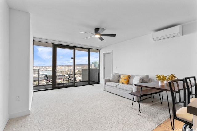 carpeted living room featuring expansive windows, a wall unit AC, and ceiling fan