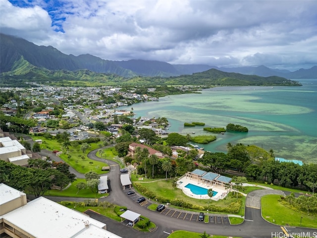 drone / aerial view with a water and mountain view