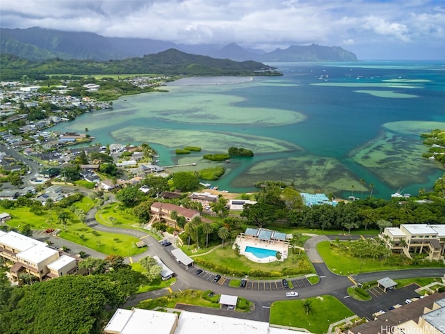 drone / aerial view featuring a water and mountain view