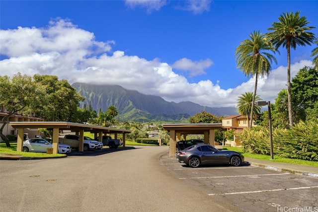 view of vehicle parking with a mountain view