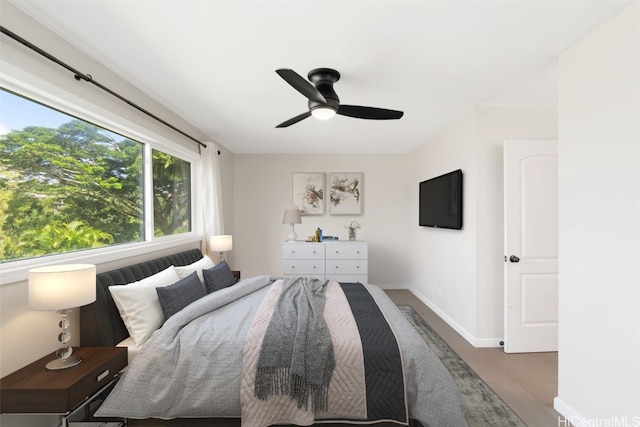 unfurnished bedroom featuring hardwood / wood-style floors and ceiling fan