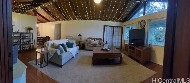 living room with vaulted ceiling and hardwood / wood-style floors