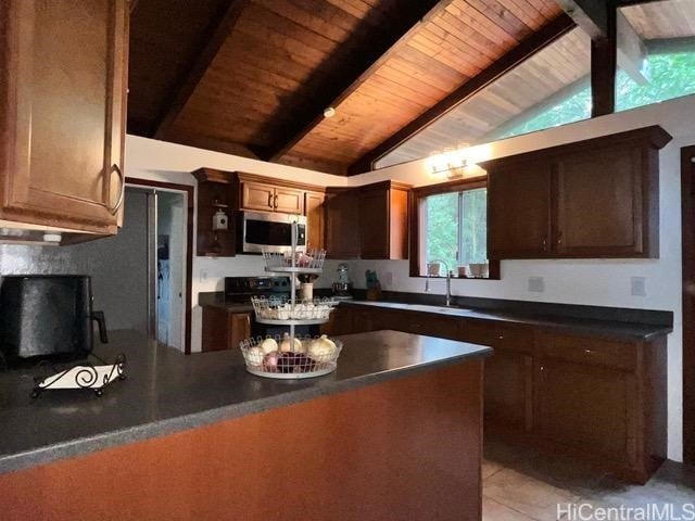 kitchen featuring vaulted ceiling with beams, sink, wooden ceiling, and light tile patterned floors