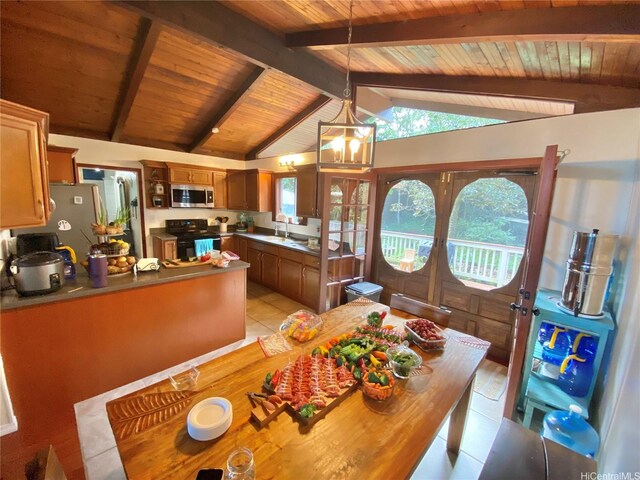 dining area featuring french doors, light tile patterned floors, and wooden ceiling