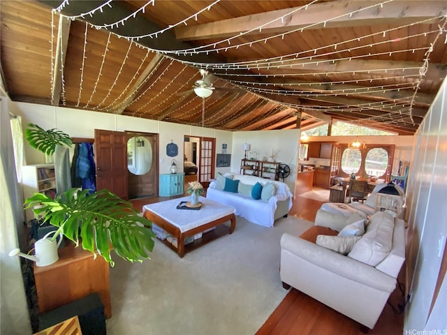 living room featuring a ceiling fan and wood ceiling