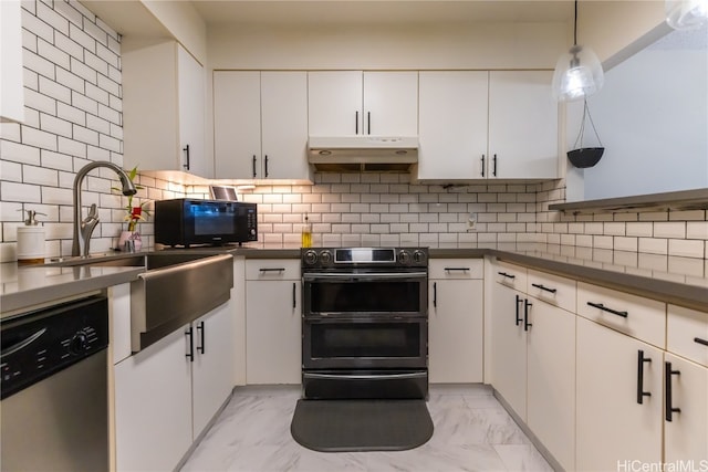 kitchen featuring white cabinetry, stainless steel appliances, tasteful backsplash, and pendant lighting