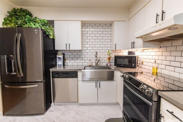 kitchen with white cabinetry, black appliances, sink, and backsplash