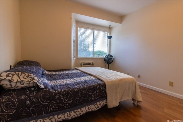 95-1058G Ainamakua Dr Unit 119, Mililani, HI 96789 - bedroom featuring wood finished floors and baseboards