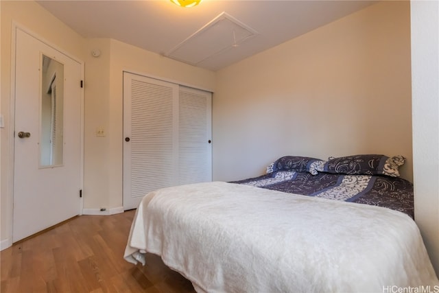 bedroom with a closet and wood-type flooring