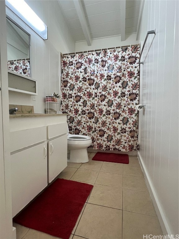 bathroom with toilet, tile patterned flooring, a shower with curtain, vanity, and beam ceiling