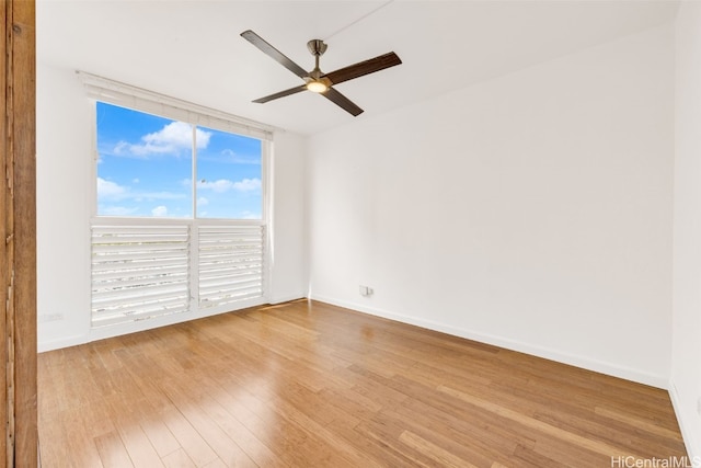 empty room with light hardwood / wood-style floors and ceiling fan