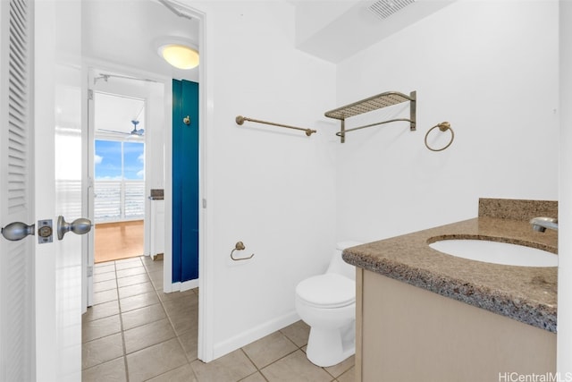 bathroom with tile patterned floors, vanity, and toilet