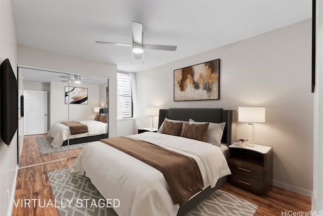 bedroom featuring a closet, baseboards, ceiling fan, and wood finished floors