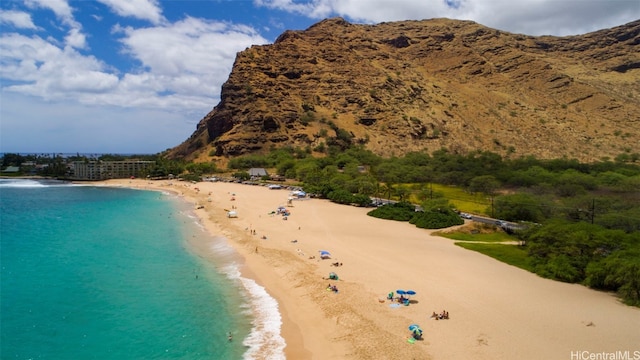 birds eye view of property with a beach view and a water view