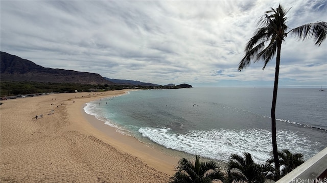 water view with a mountain view and a beach view