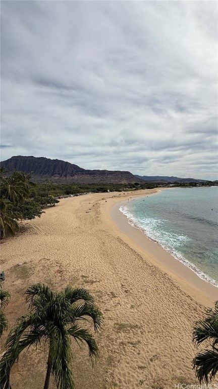 view of water feature with a mountain view and a beach view