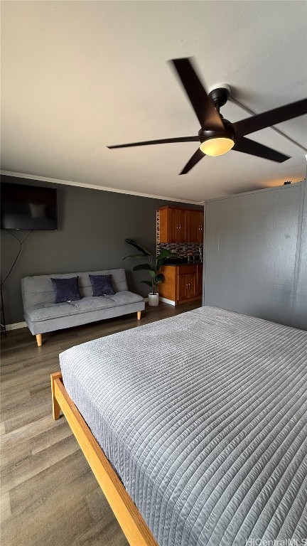 bedroom featuring ceiling fan and dark wood-type flooring