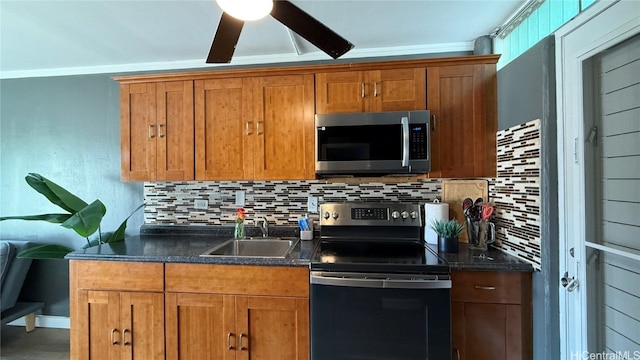 kitchen featuring decorative backsplash, stainless steel appliances, ornamental molding, and sink