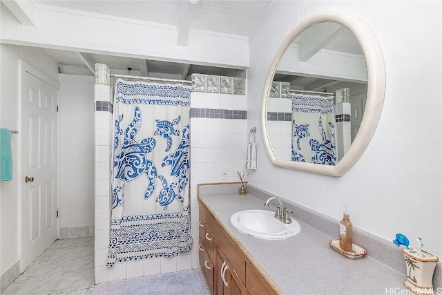 bathroom featuring walk in shower, tile patterned flooring, and vanity