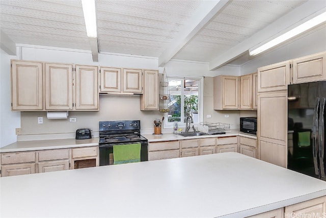 kitchen with light brown cabinetry, sink, black appliances, and lofted ceiling with beams