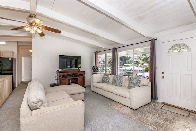 carpeted living room featuring vaulted ceiling with beams, ceiling fan, and wood ceiling