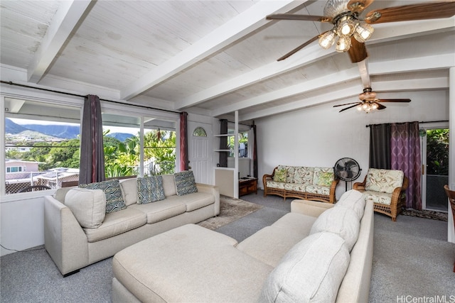 carpeted living room featuring lofted ceiling with beams and ceiling fan