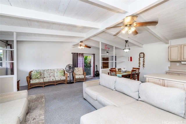 living room with ceiling fan, lofted ceiling with beams, and carpet floors