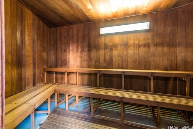 view of sauna / steam room featuring wood walls, hardwood / wood-style floors, and wooden ceiling