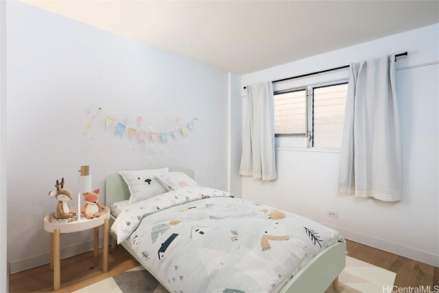 bedroom featuring hardwood / wood-style floors