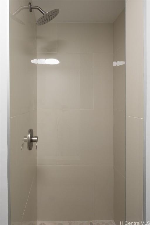 bathroom with a tile shower