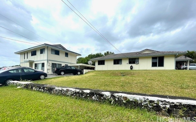 view of home's exterior with a yard