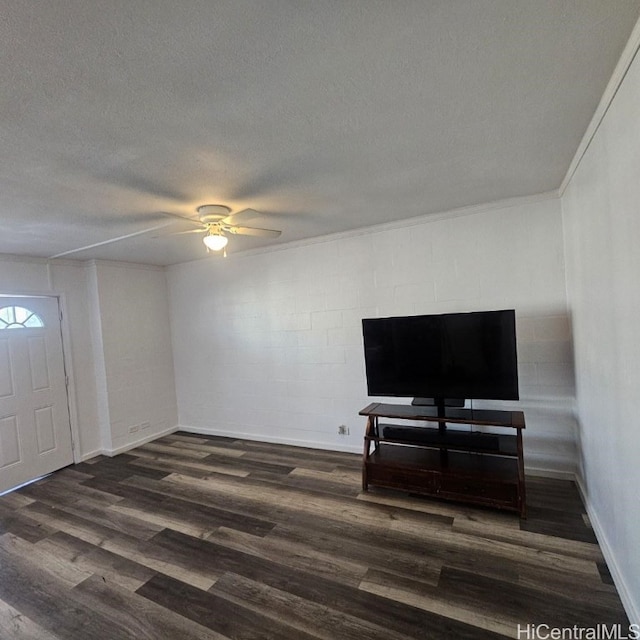 living room with dark hardwood / wood-style floors, ceiling fan, and a textured ceiling