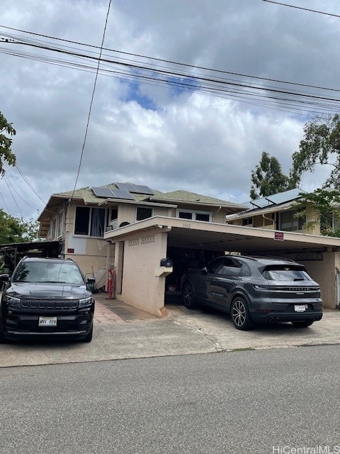 view of front of house featuring a carport