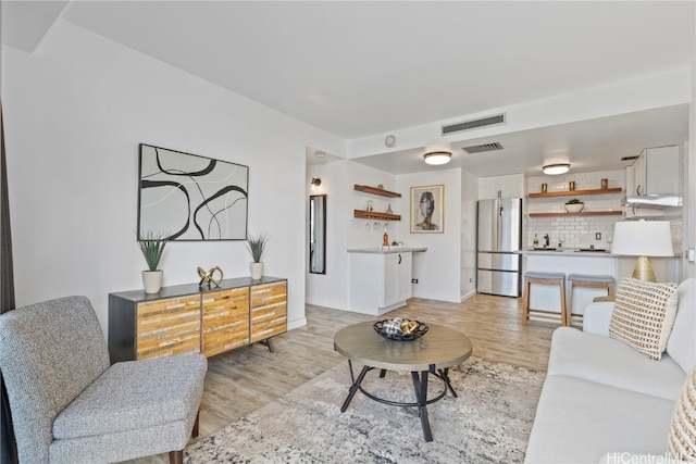 living room featuring light wood-type flooring