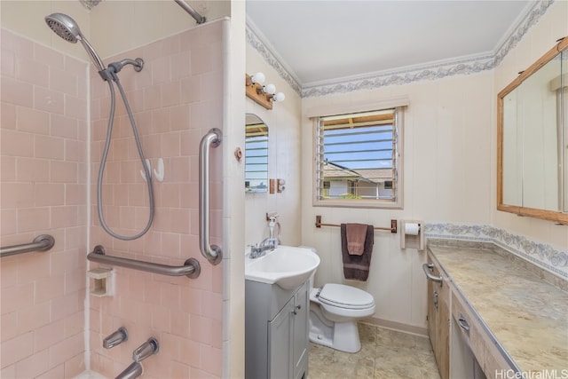 full bathroom with crown molding, vanity, tiled shower / bath combo, and toilet