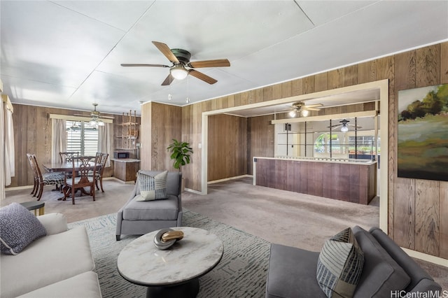 living room with wooden walls and carpet