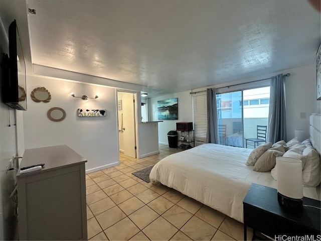 tiled bedroom with access to exterior