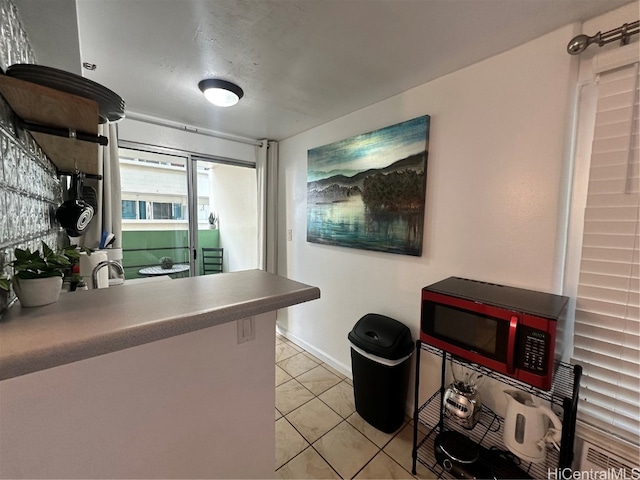 kitchen featuring light tile patterned flooring