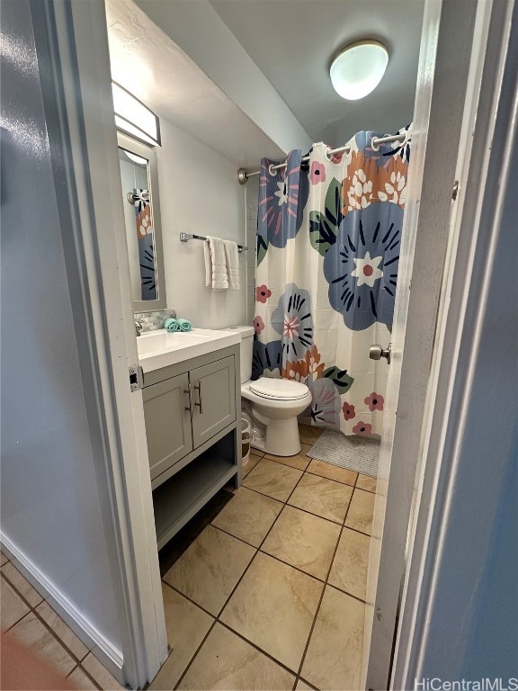 bathroom with vanity, a shower with shower curtain, tile patterned floors, and toilet