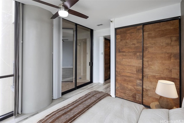 unfurnished bedroom with light wood-type flooring and ceiling fan